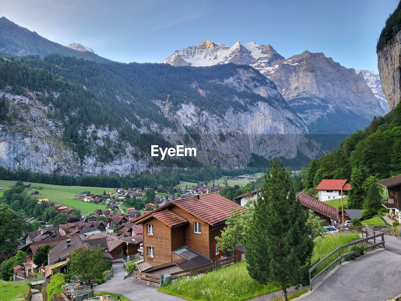 high angle view of townscape by mountains against sky