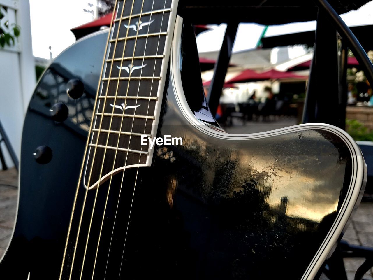 CLOSE-UP OF GUITAR IN THE CAMERA