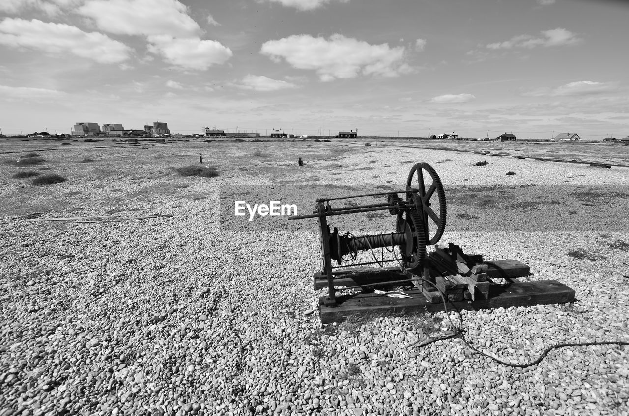 Old rusty machine against sky