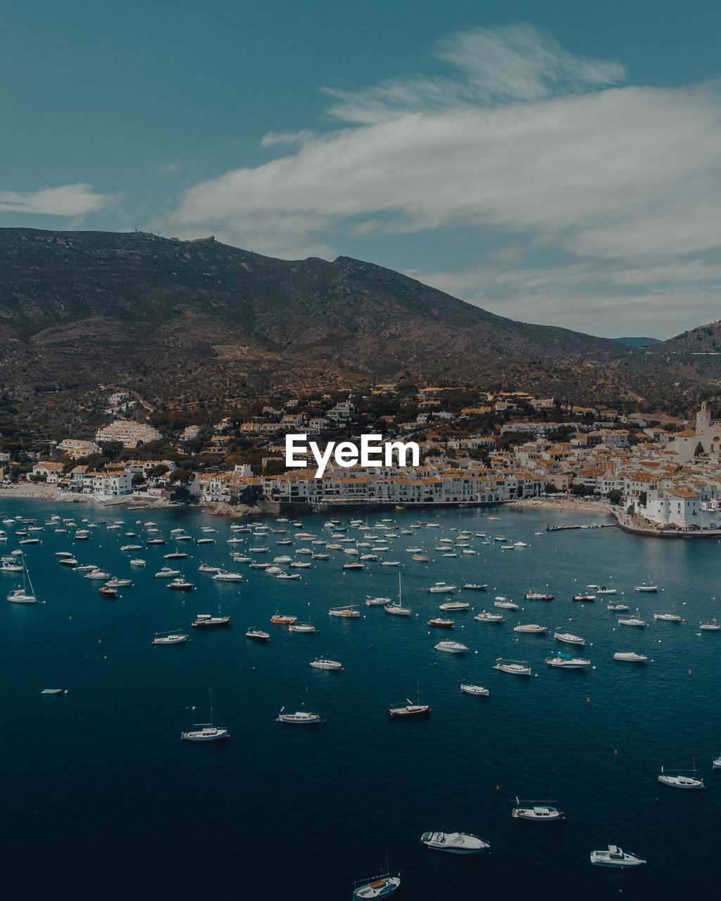 Scenic view of sea and mountains against sky