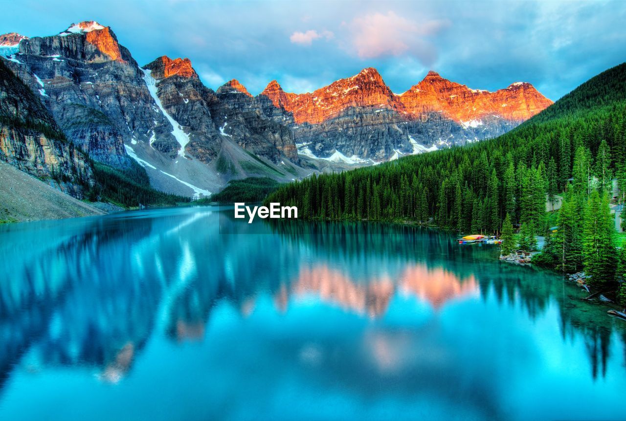 Scenic view of lake and mountains against sky