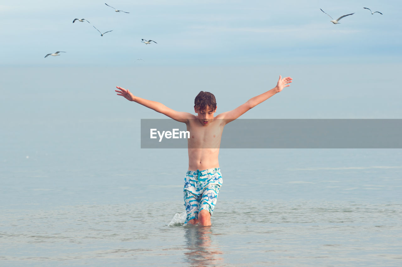 Front view of boy in sea