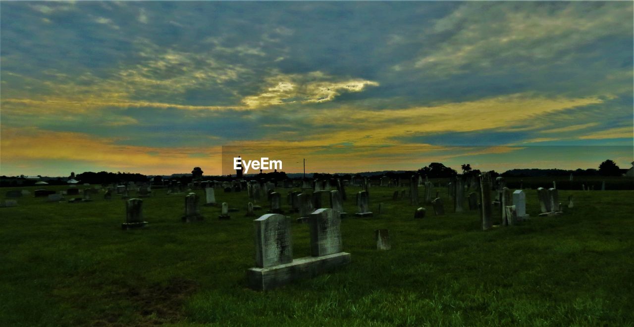 CEMETERY AGAINST SKY DURING SUNSET