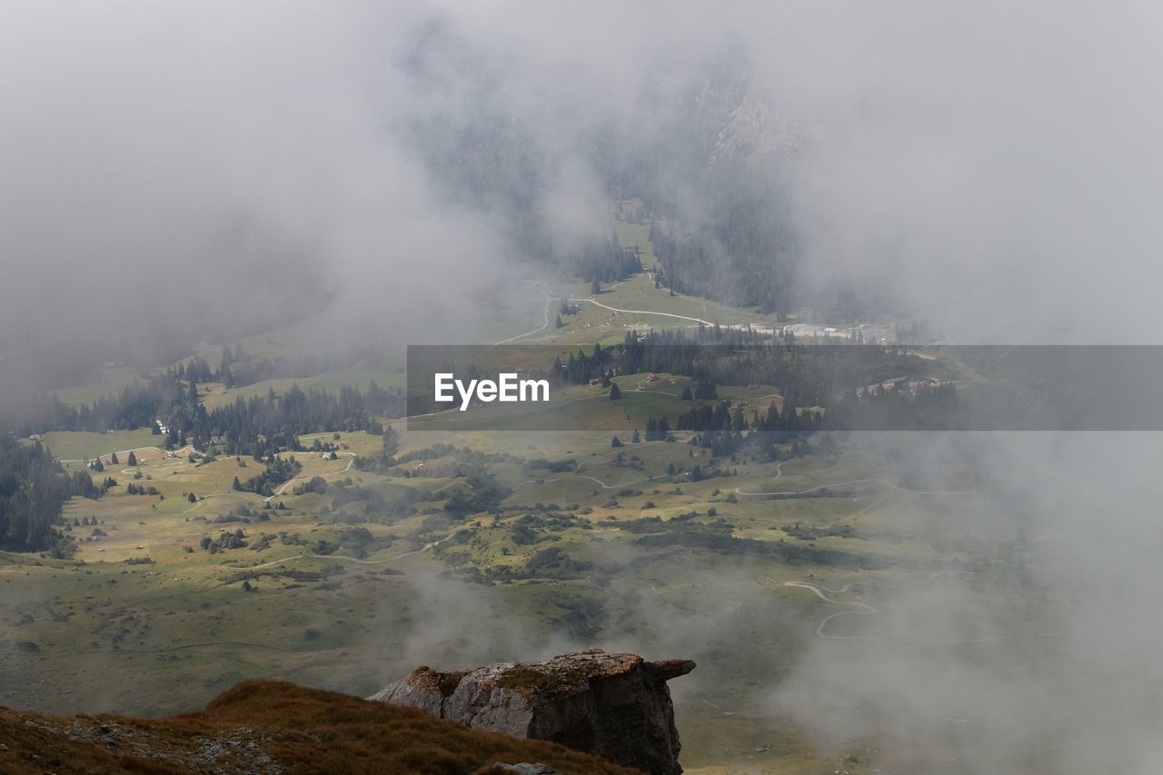 Smoke emitting from volcanic mountain against sky