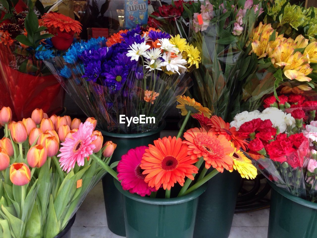Various flowers in container for sale at market