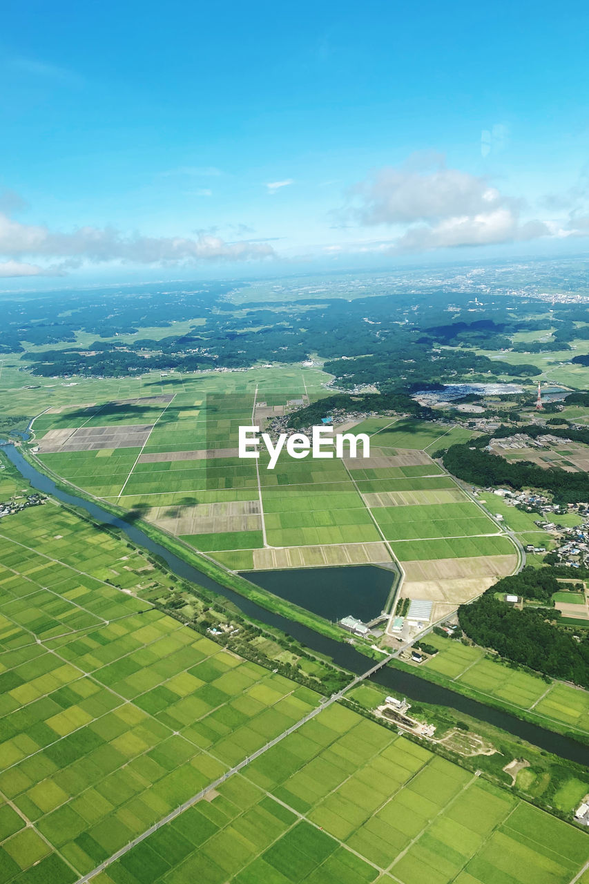 Aerial view of agricultural field against sky