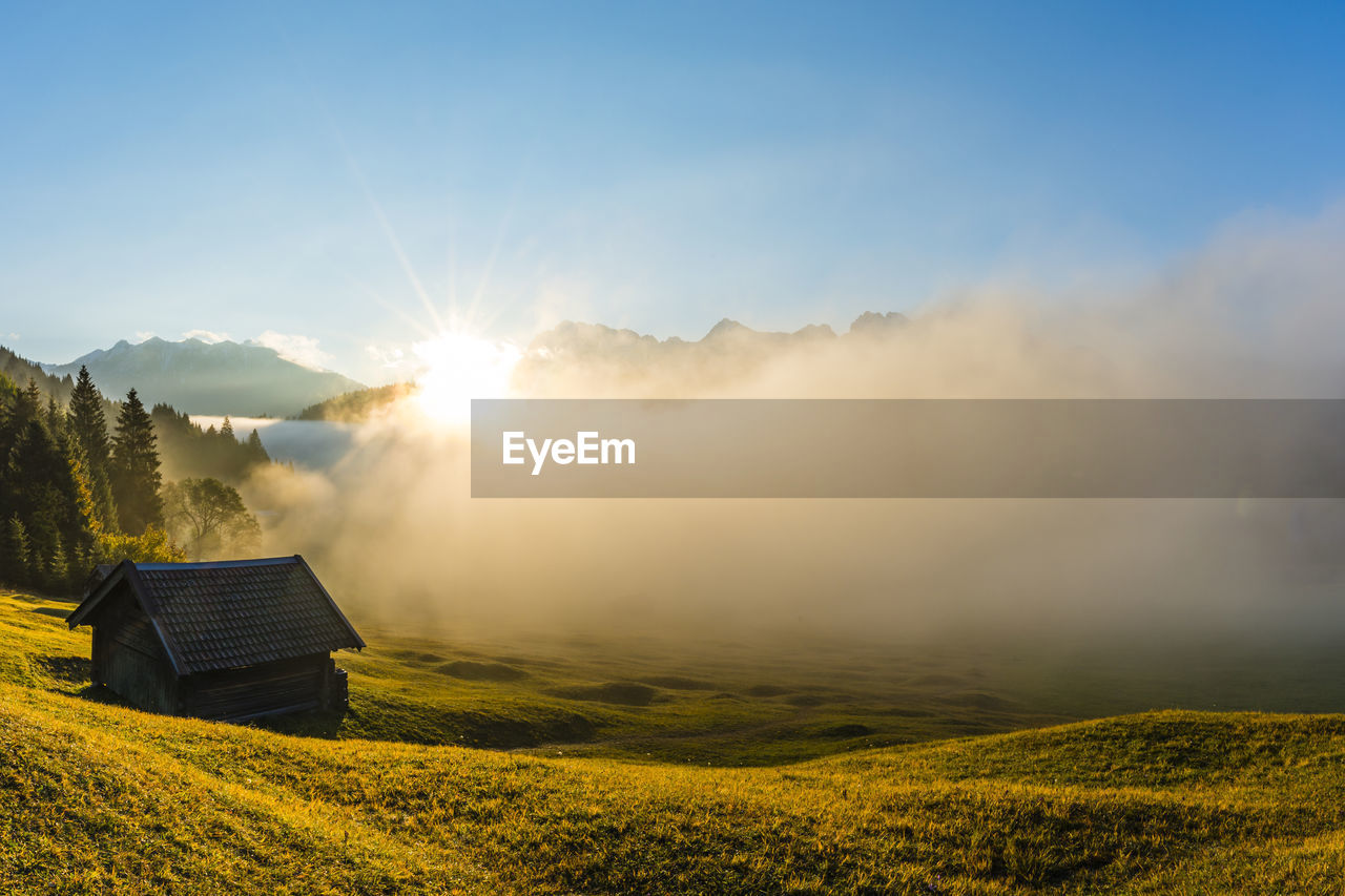 Thick fog shrouding geroldsee lake at autumn sunrise