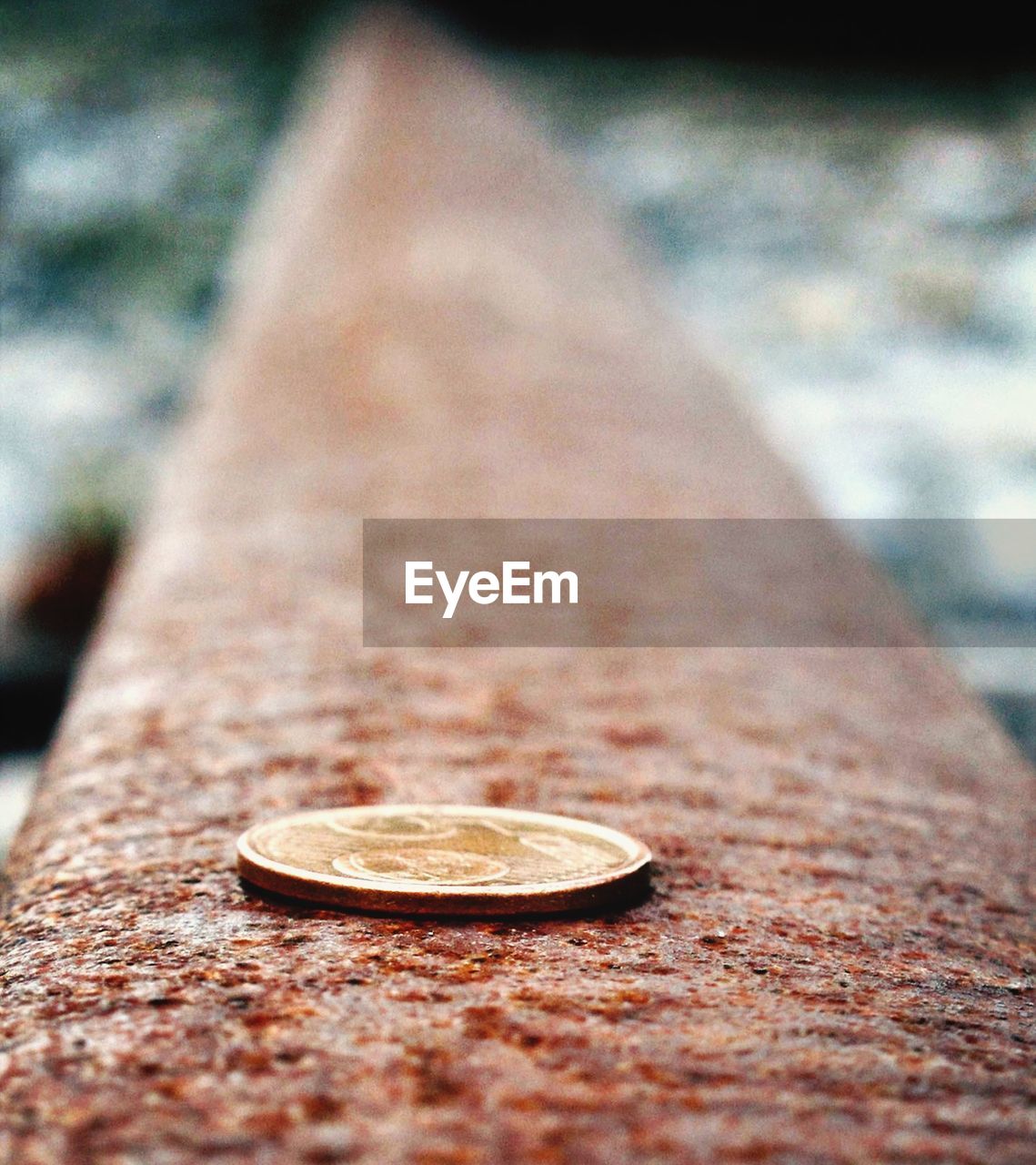 Coin on railroad track