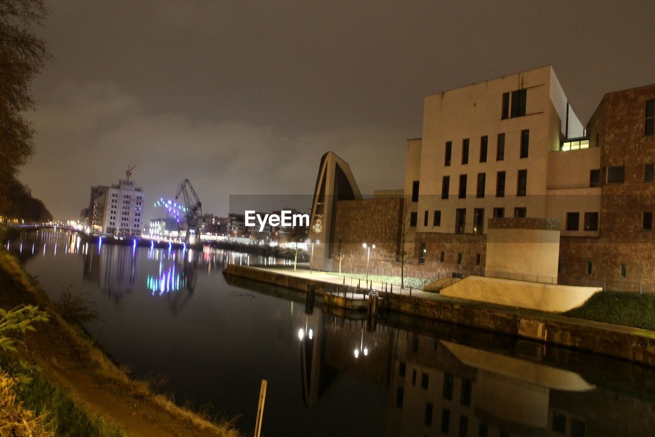 REFLECTION OF ILLUMINATED BUILDINGS IN WATER