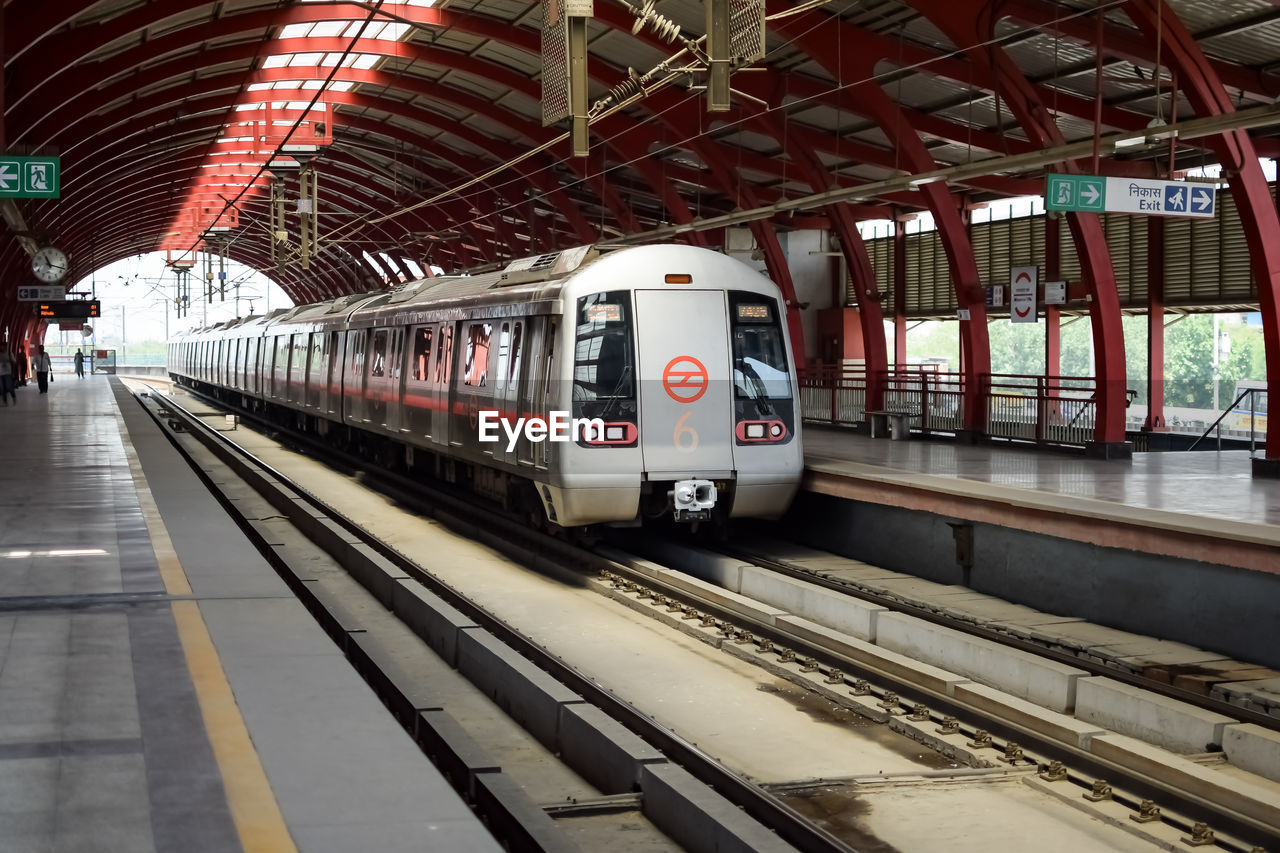 Delhi metro train arriving at jhandewalan metro station in new delhi, india, asia, public metro