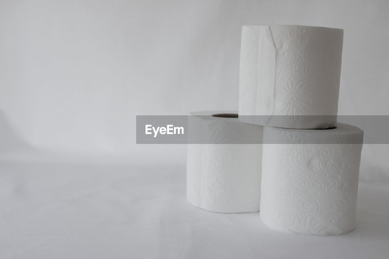 toilet paper, paper towel, cylinder, white, indoors, paper, no people, rolled up, ceramic, lighting, simplicity, copy space, still life, studio shot, close-up, vase, hygiene