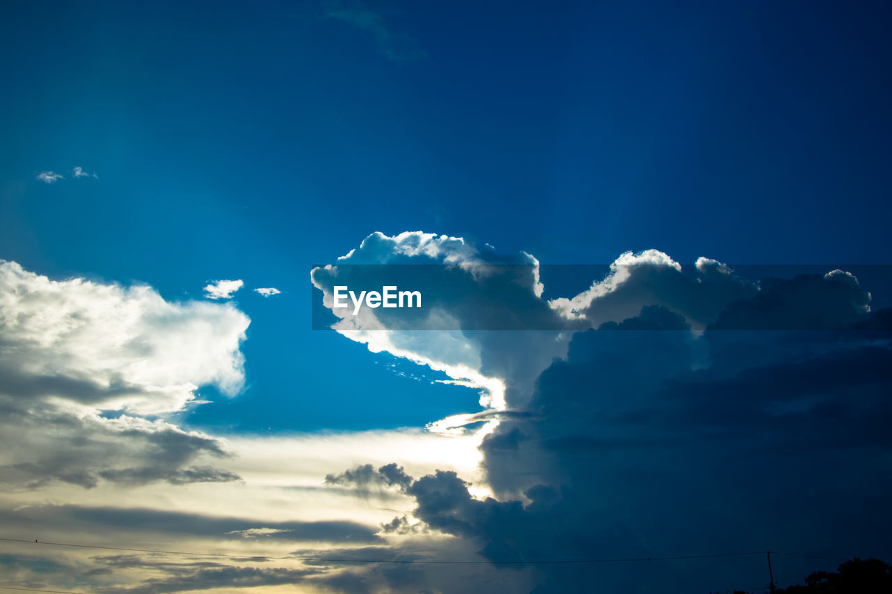 LOW ANGLE VIEW OF CLOUDS IN BLUE SKY