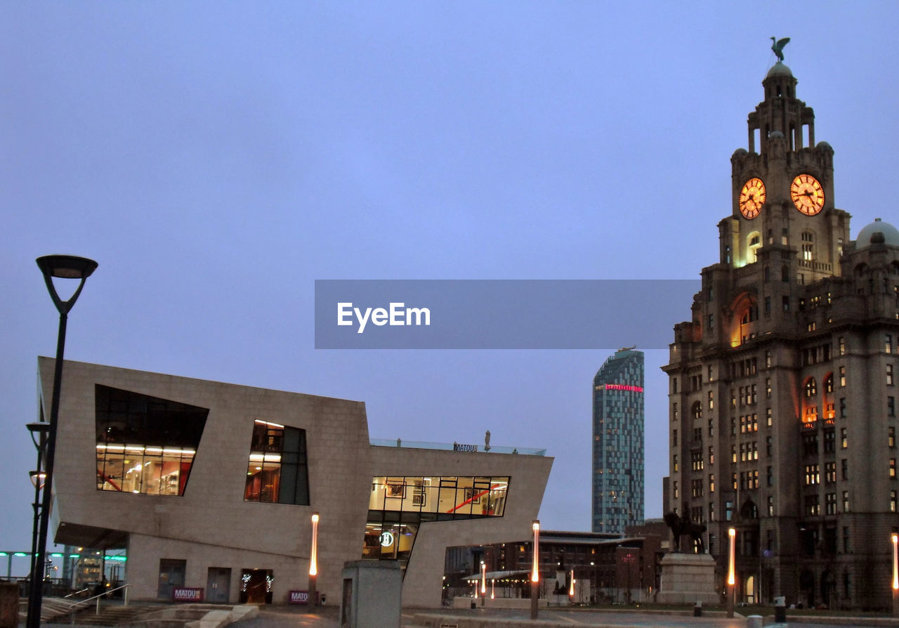 LOW ANGLE VIEW OF BUILDINGS AGAINST CLEAR SKY