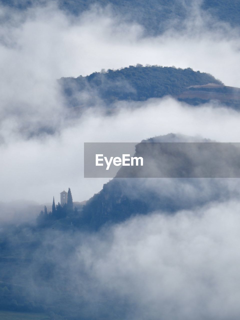 cloud, mountain, fog, sky, environment, landscape, scenics - nature, nature, mountain range, beauty in nature, travel, no people, architecture, snow, cloudscape, travel destinations, outdoors, land, mountain peak, mist, tourism, blue, morning, horizon, tranquility, building, city, built structure, day, social issues, winter, overcast, religion, high up