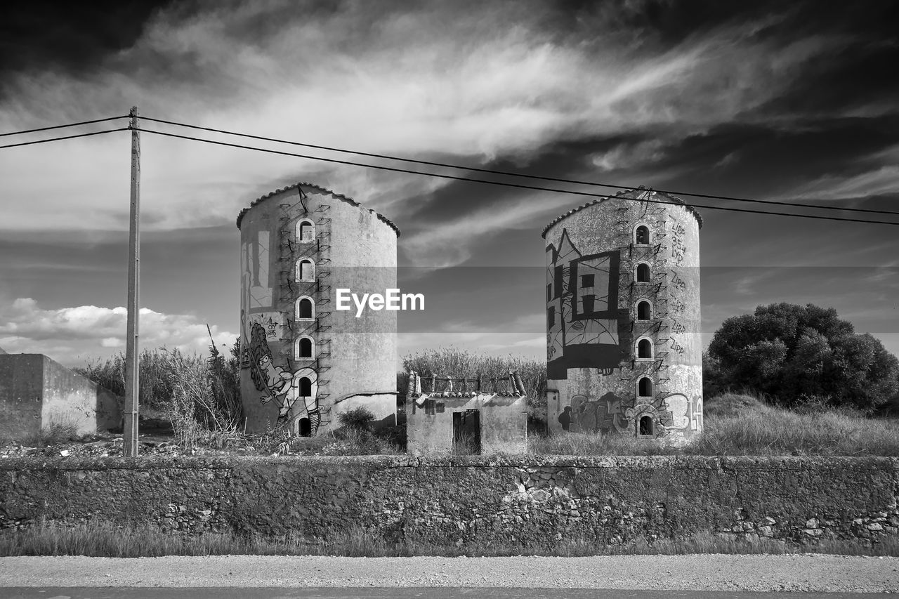 VIEW OF OLD FACTORY AGAINST SKY