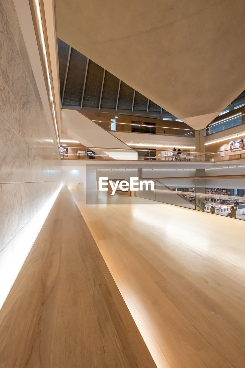 INTERIOR OF ILLUMINATED EMPTY BUILDING