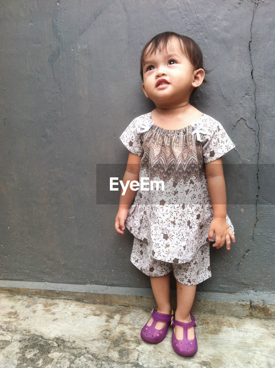 childhood, child, full length, one person, innocence, cute, toddler, standing, portrait, dress, casual clothing, person, front view, pattern, baby, female, footwear, fashion, pink, women, shoe, clothing, baby & toddler clothing, looking, emotion, looking at camera, wall - building feature, human face, spring, smiling, day, lifestyles, skin, sitting, baby clothing