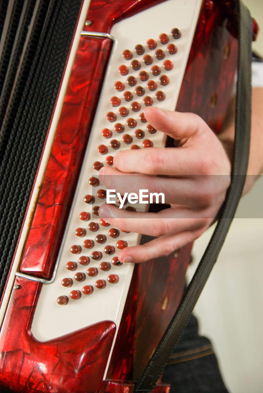 Close-up of musician playing accordion