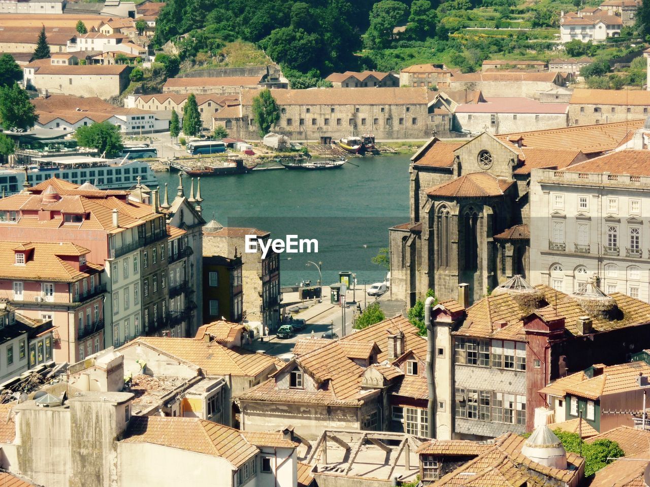 High angle view of buildings and river in city