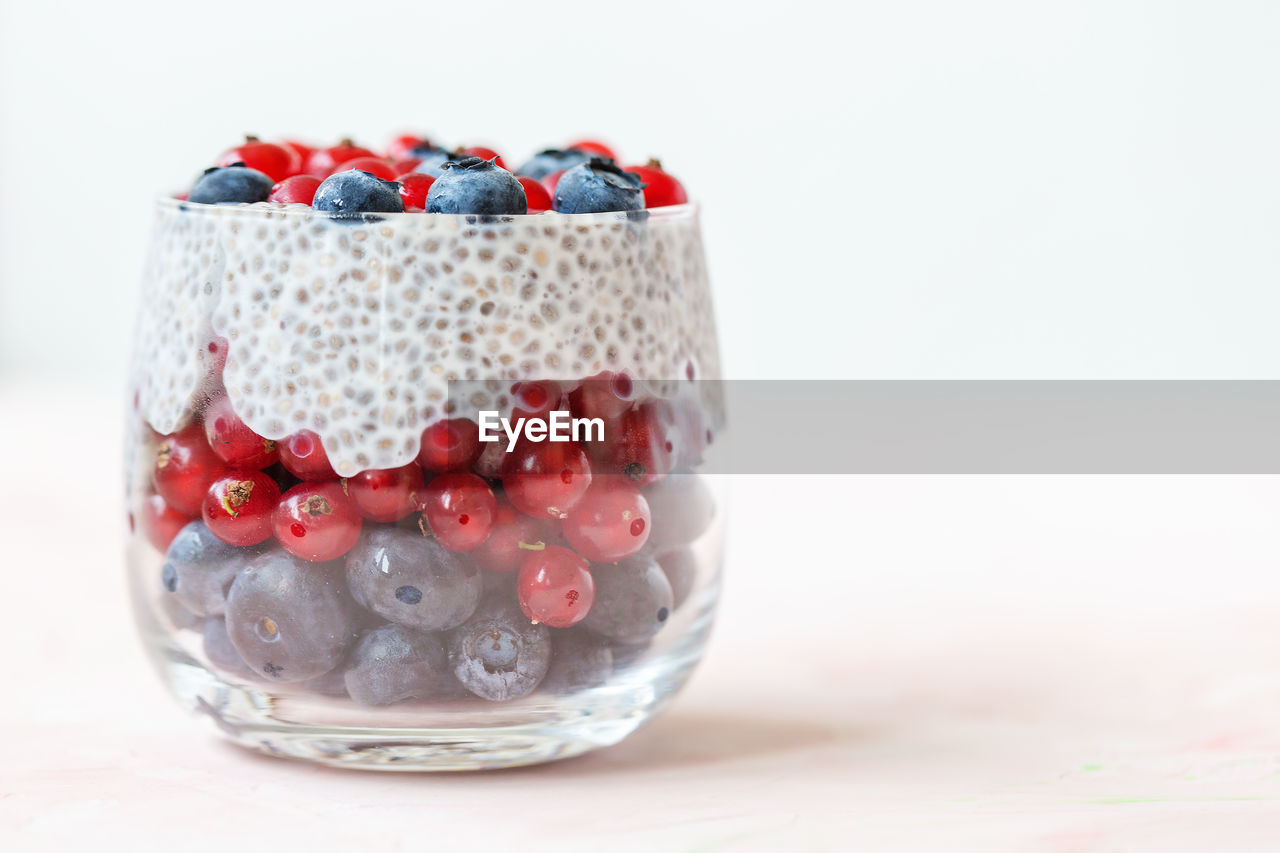 Chia seed pudding with blueberries and red currant