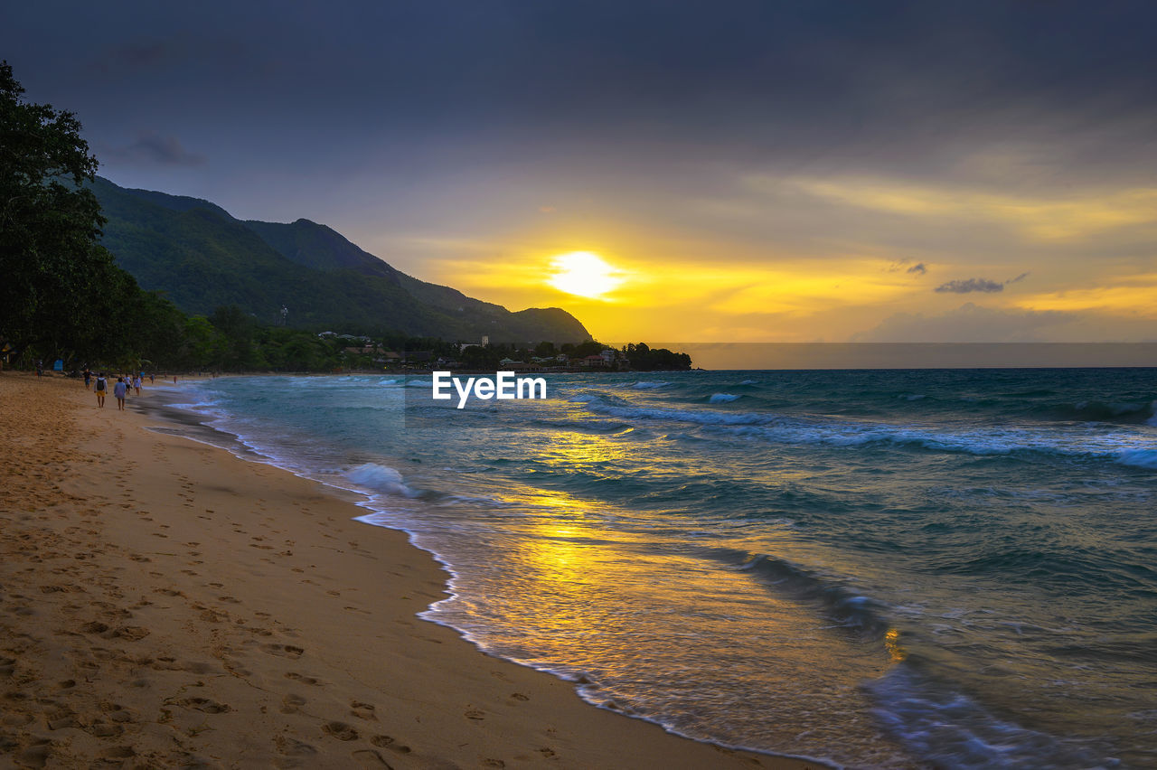 scenic view of sea at sunset