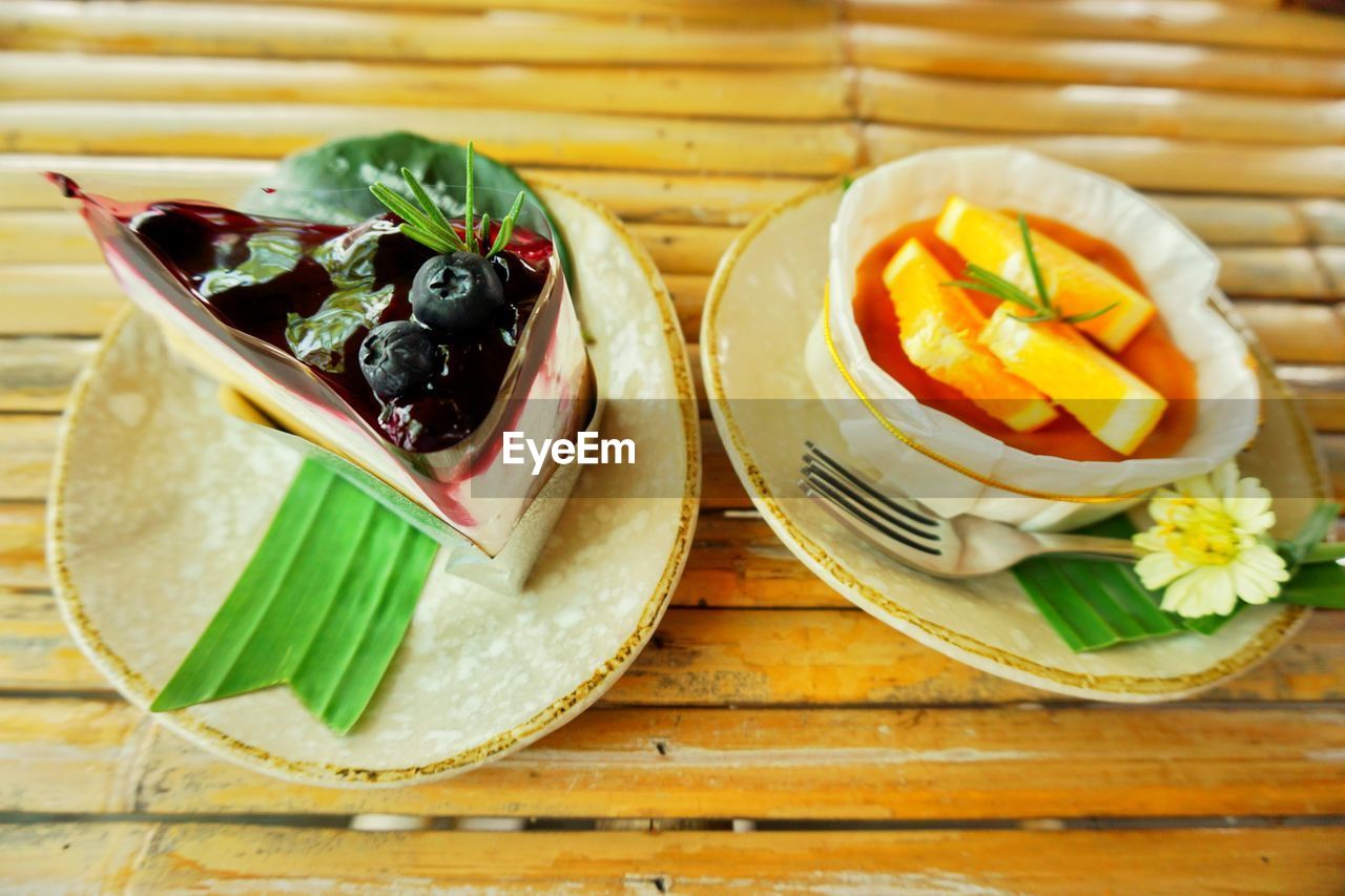 food and drink, food, healthy eating, dish, freshness, meal, wood, wellbeing, produce, no people, plate, fruit, vegetable, fast food, table, lunch, indoors, high angle view, still life, cuisine, breakfast, bowl, leaf, sweet food