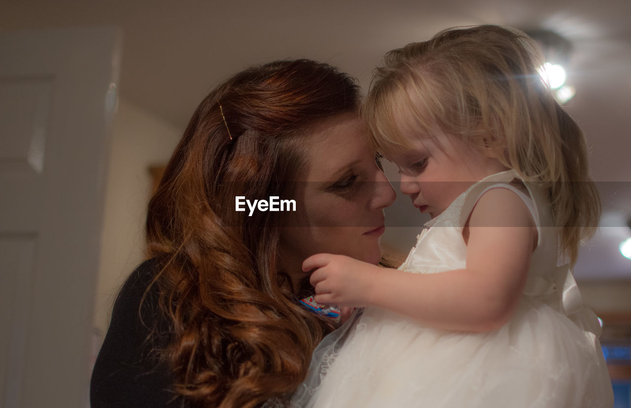 Close-up of mother with cute daughter