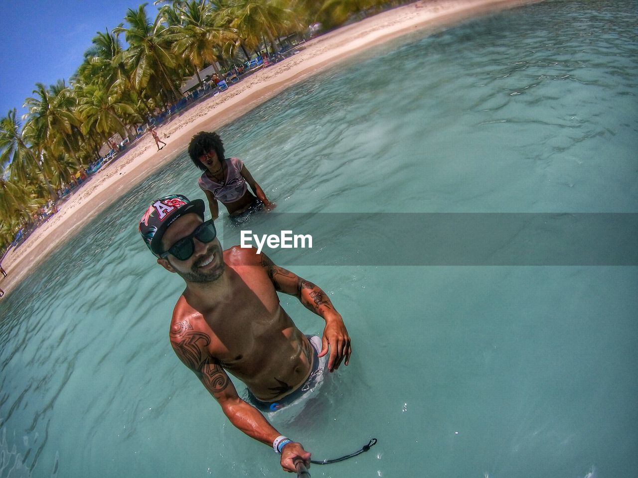 HIGH ANGLE VIEW OF MAN IN SWIMMING POOL