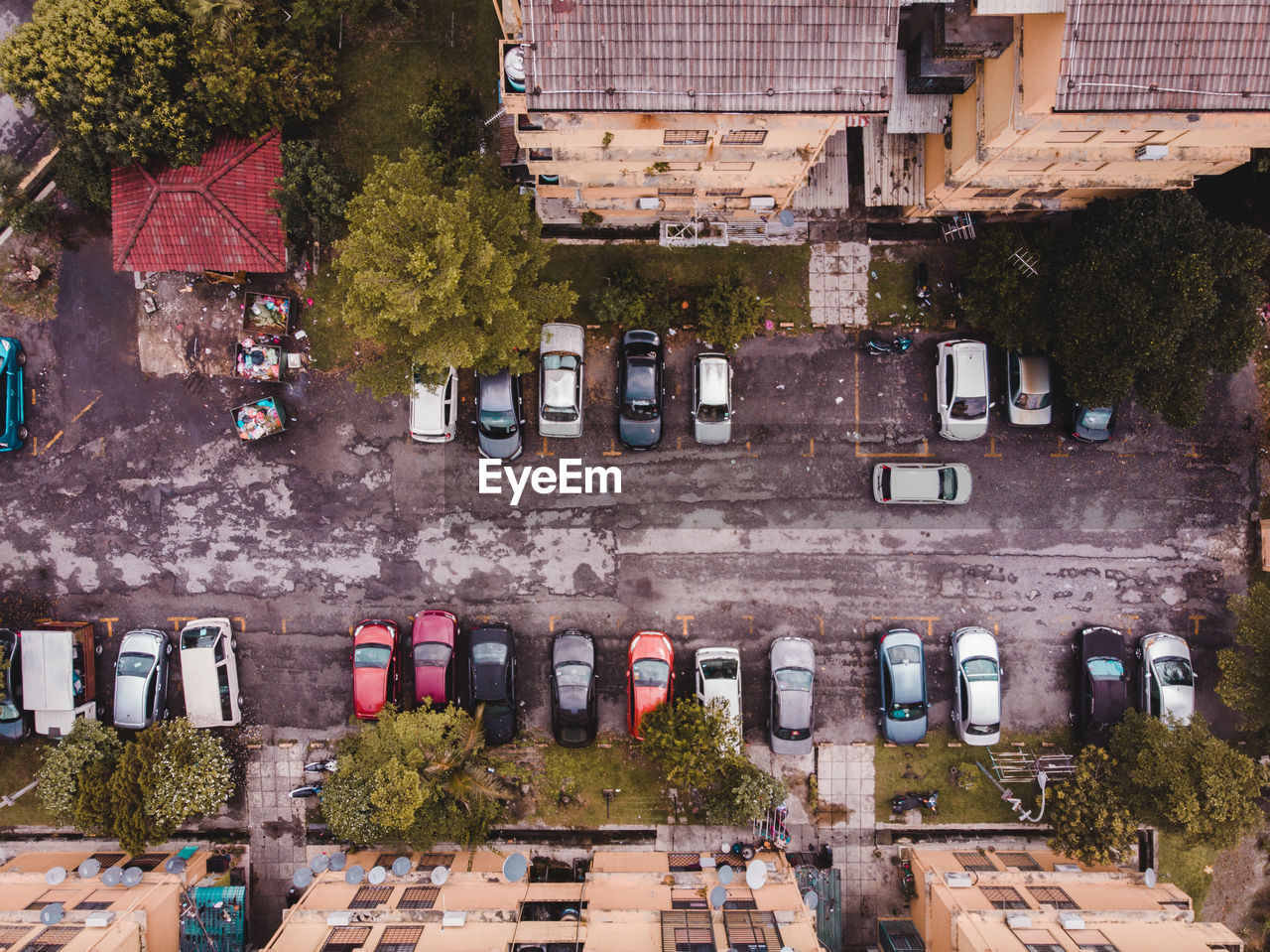 Directly above shot of cars on road by buildings