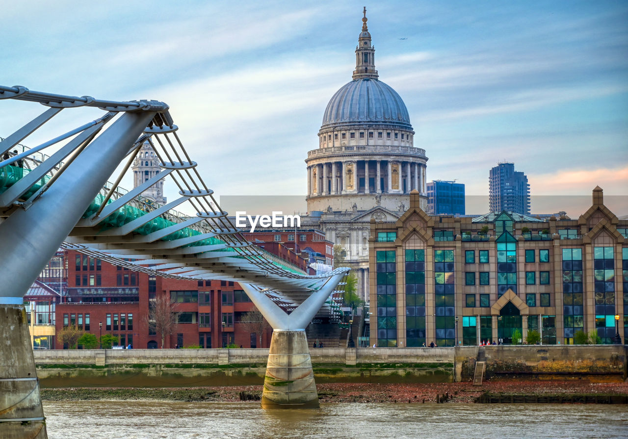 BRIDGE OVER RIVER AGAINST BUILDINGS