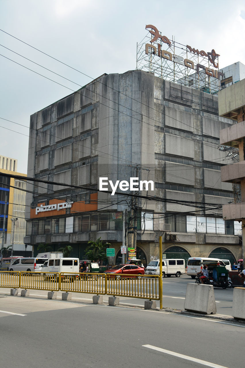 VIEW OF CITY STREET AND BUILDINGS