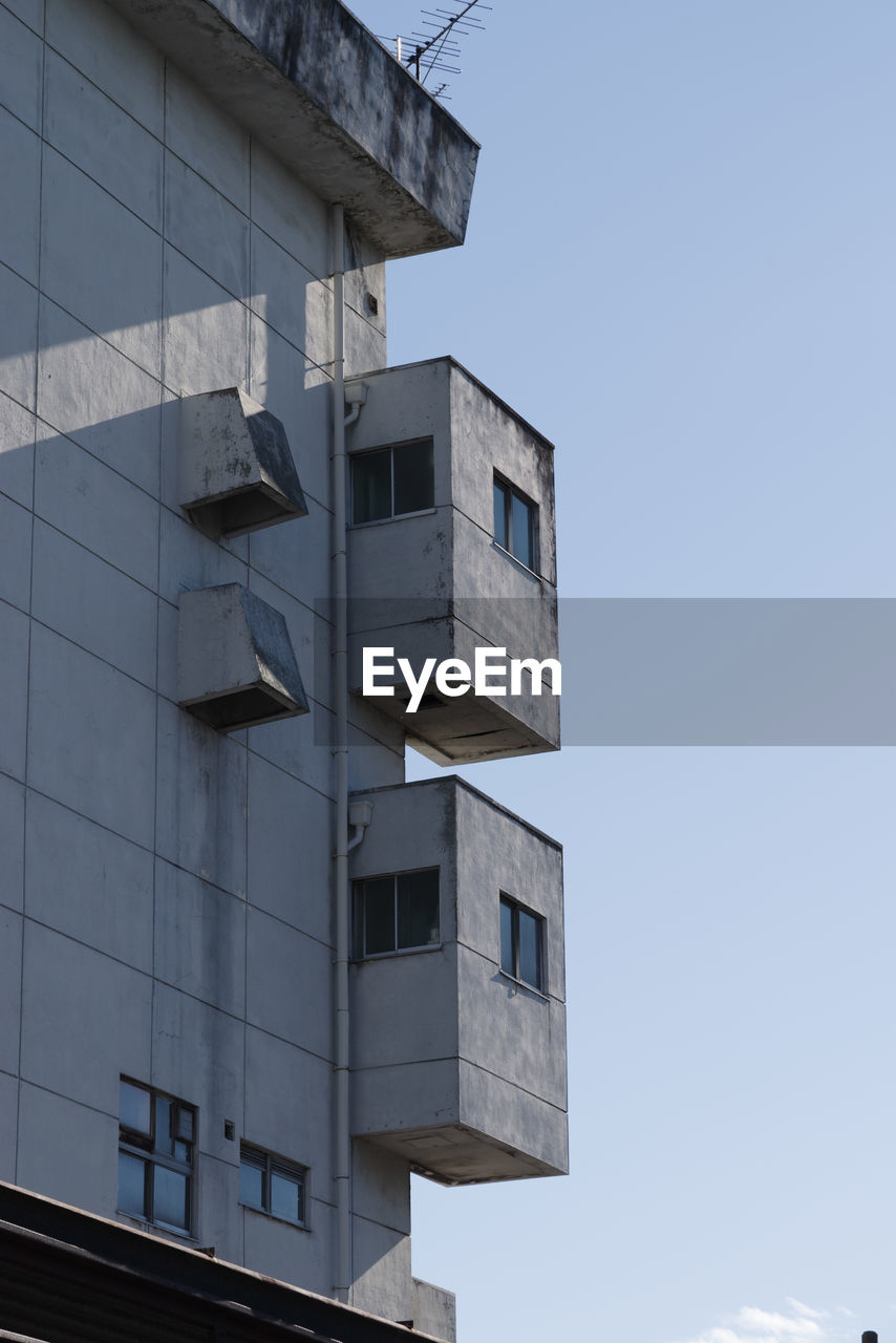 low angle view of building against clear blue sky