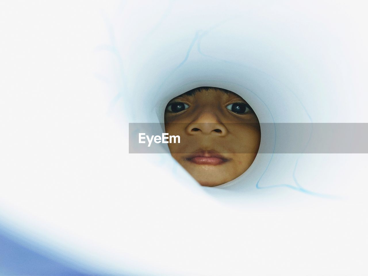 CLOSE-UP PORTRAIT OF BOY WITH EYES