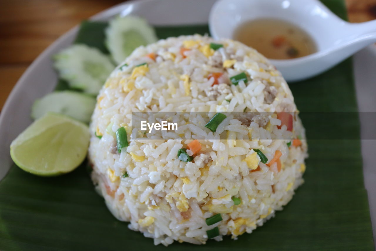CLOSE-UP OF RICE SERVED ON TABLE