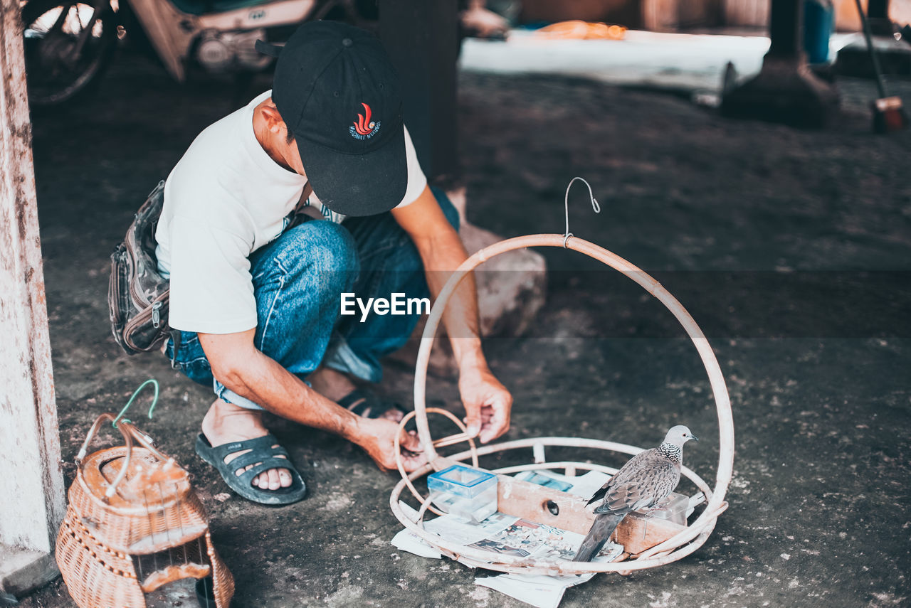 LOW SECTION OF MAN WORKING WITH UMBRELLA