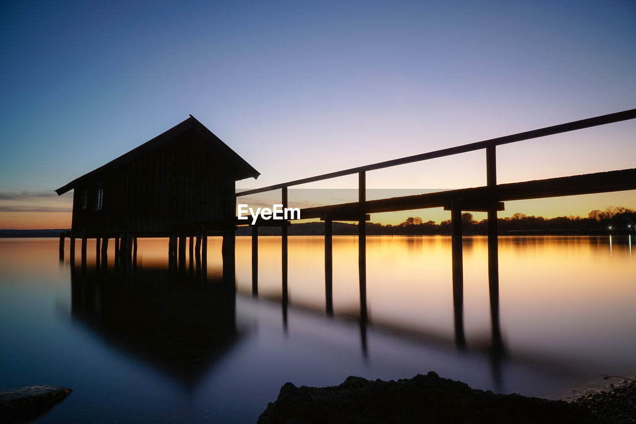 Scenic view of sea against clear sky during sunset