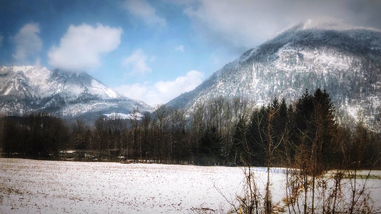 PANORAMIC SHOT OF SNOWCAPPED MOUNTAINS AGAINST SKY