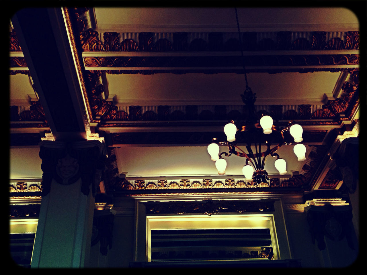 LOW ANGLE VIEW OF ILLUMINATED LAMP POST