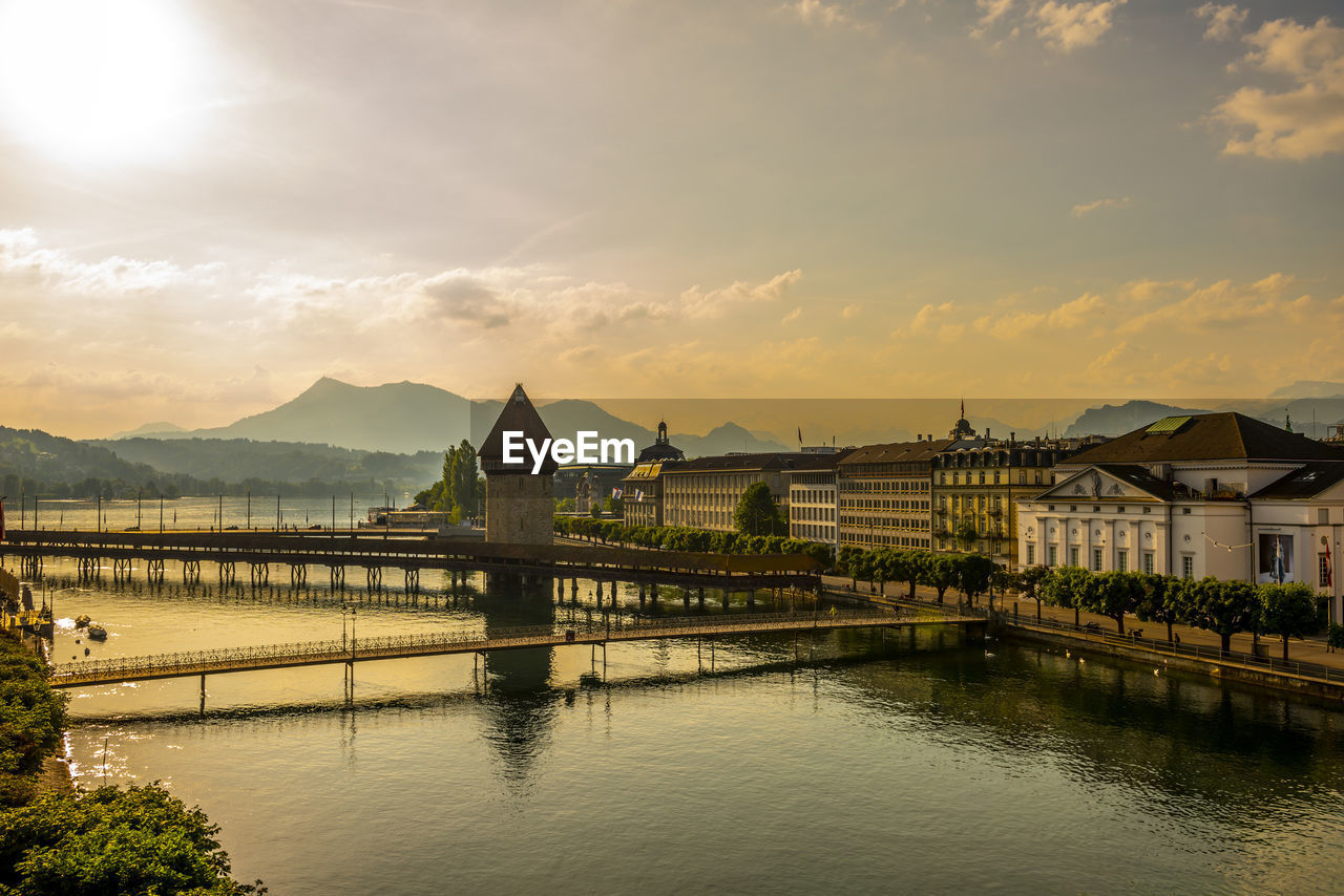 Aerial view over chapel bridge and city in golden hour in lucerne, switzerland.