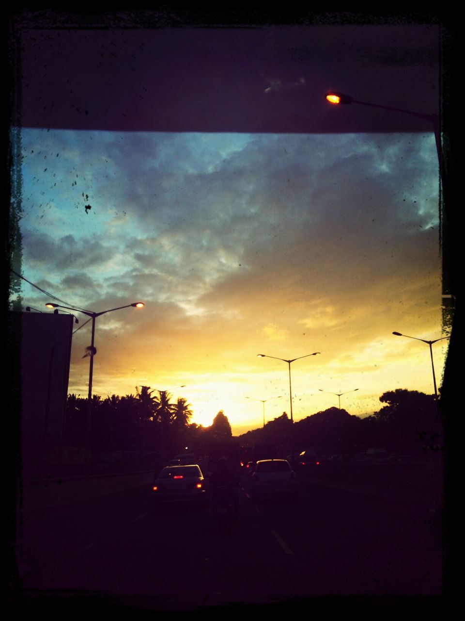 VIEW OF ROAD AT SUNSET