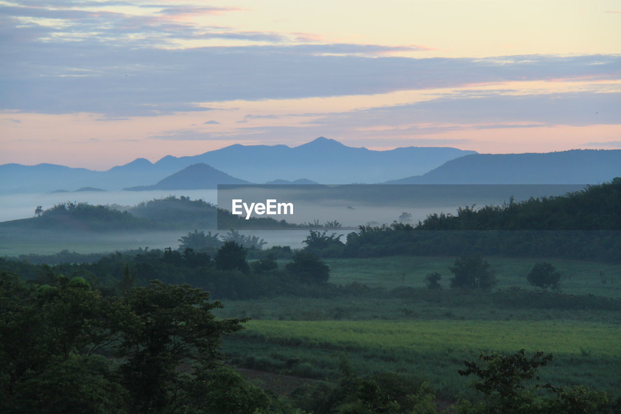 Scenic view of landscape against sky during sunset