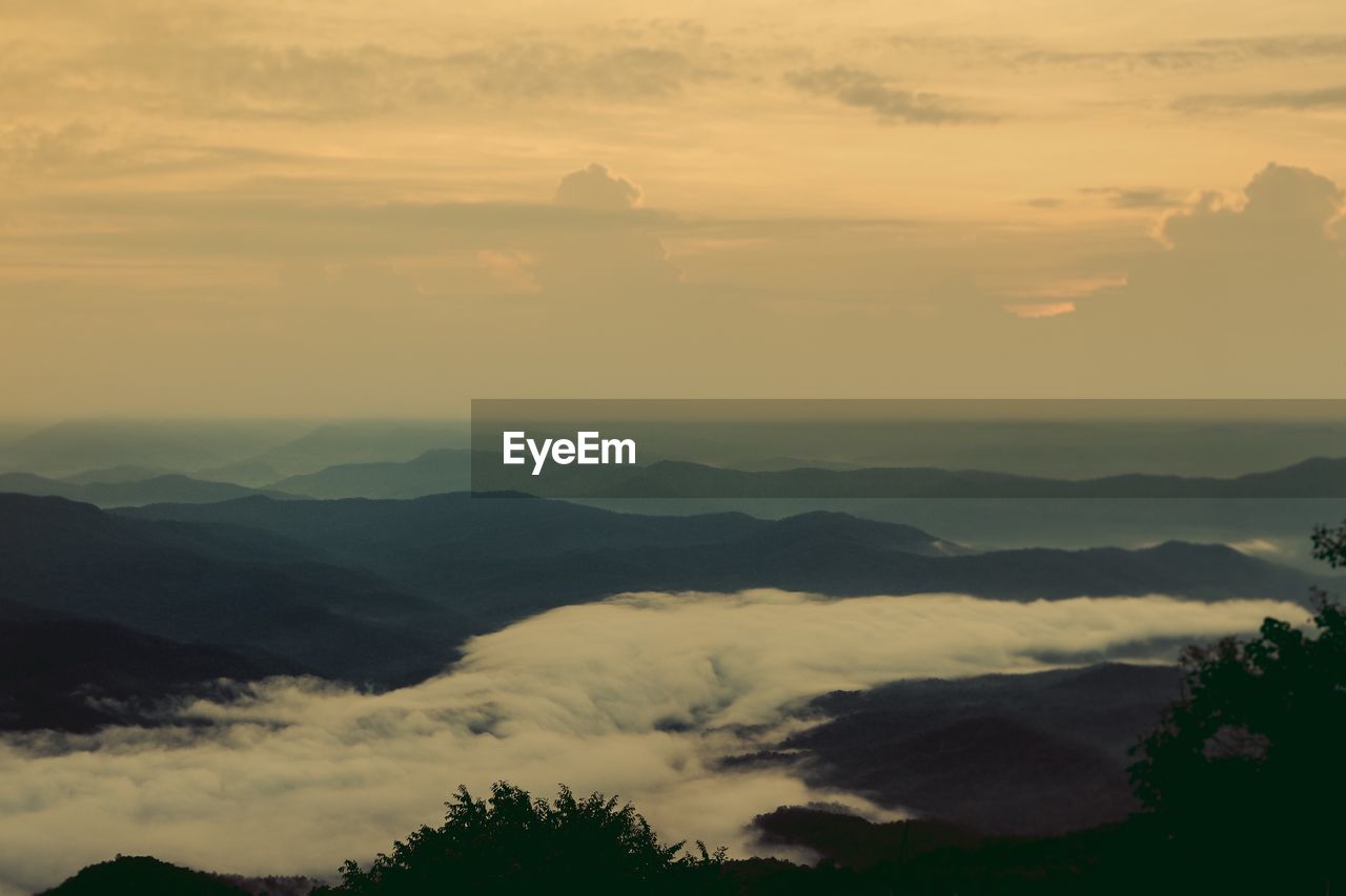 Scenic view of mountains against sky during sunset