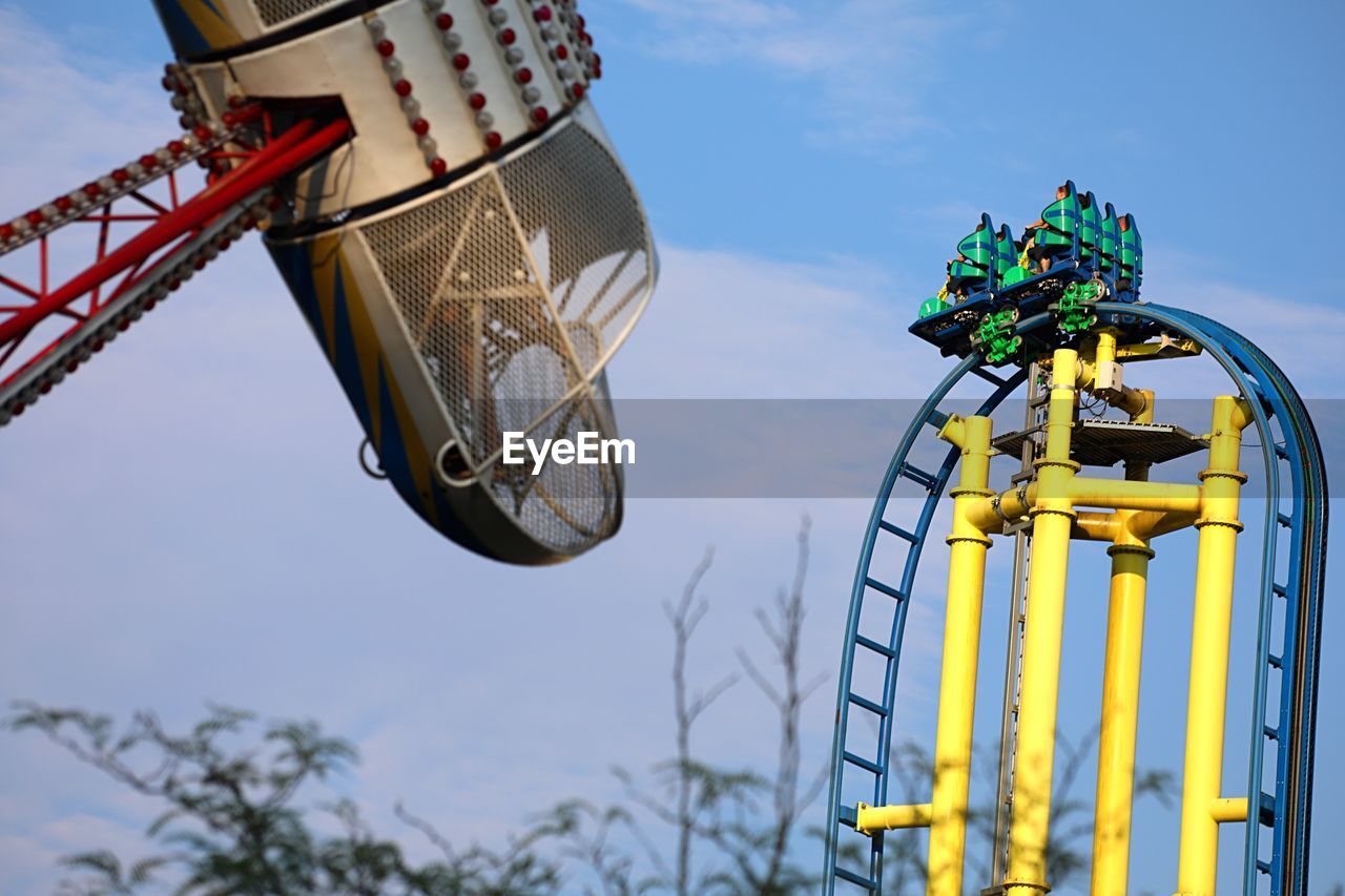 Low angle view of ferris wheel against sky