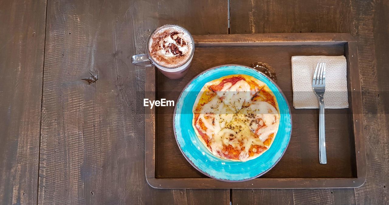 Directly above shot of food and drink served on table