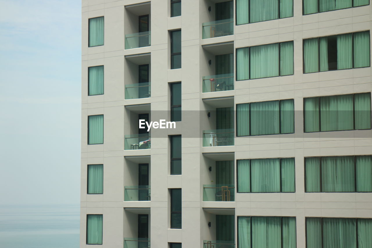 architecture, building exterior, built structure, tower block, building, window, condominium, facade, residential area, no people, city, residential district, apartment, day, full frame, outdoors, low angle view, neighbourhood, in a row, backgrounds, nature, repetition, skyscraper