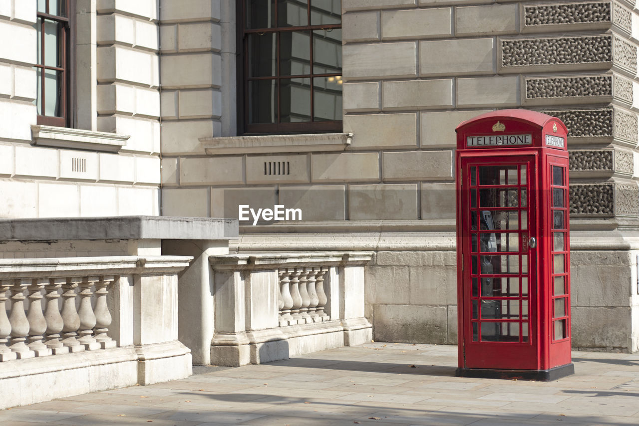 RED TELEPHONE BOOTH ON STREET