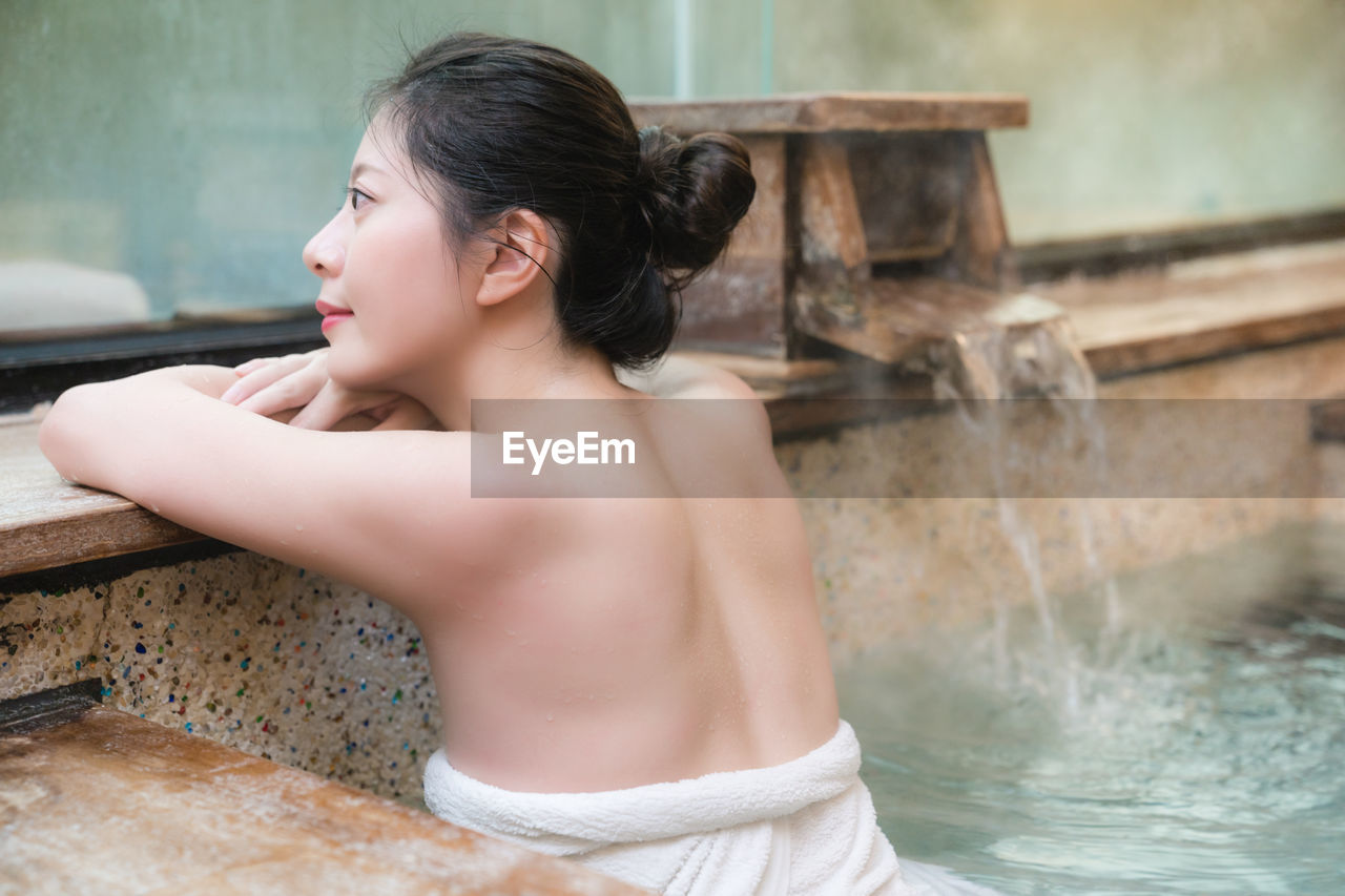 Young woman swimming in pool