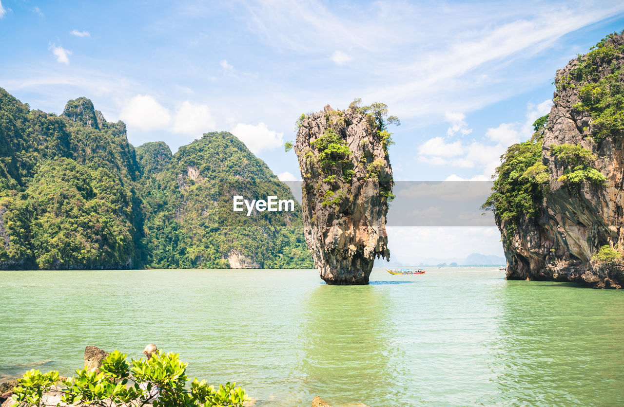 SCENIC VIEW OF SEA AGAINST ROCK FORMATION