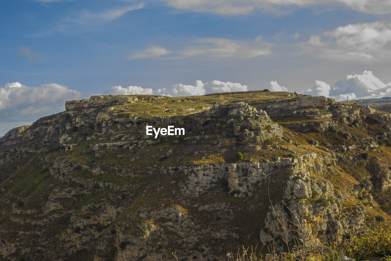 Scenic view of rocky mountains against sky