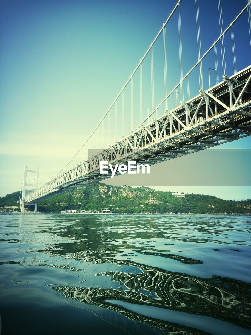 Low angle view of great seto bridge against clear sky